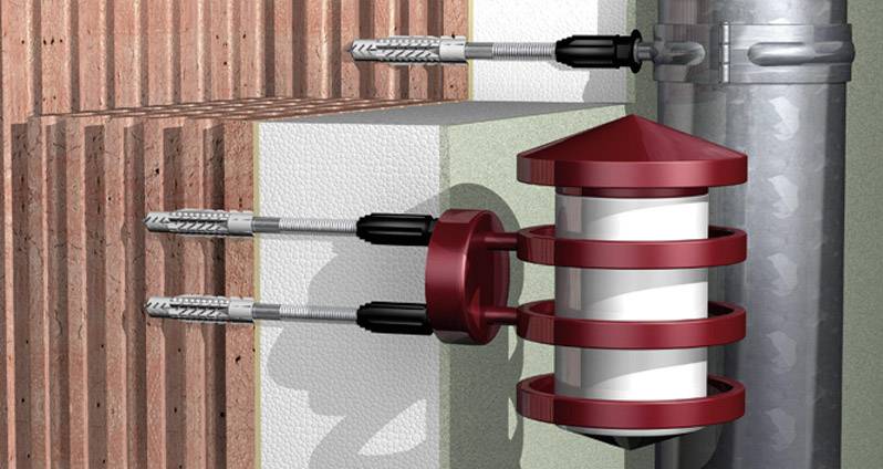 Illustration d'un système de ventilation traversant un mur avec des éléments de ventilation circulaires rotatifs et deux conduits.
