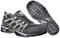 Baskets de sport noires avec logo blanc et accents gris, neuves et placées côte à côte, montrant clairement le profil de la semelle.