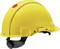 Un casque de sécurité jaune avec un point rouge au sommet, symbole de la sécurité au travail sur les chantiers de construction.