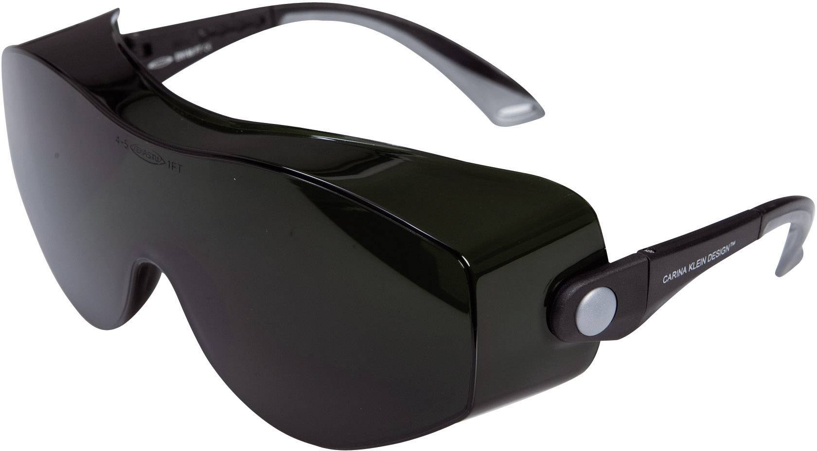 Des lunettes de soleil noires au design futuriste, massif, avec des branches larges.