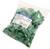 Un sac en plastique transparent contient de nombreux protège-câbles verts pour câbles réseau, avec une étiquette de marque 'LogiLink'.