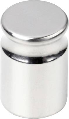 Sjajni metalni uteg, cilindričnog oblika, položen na glatkoj površini.