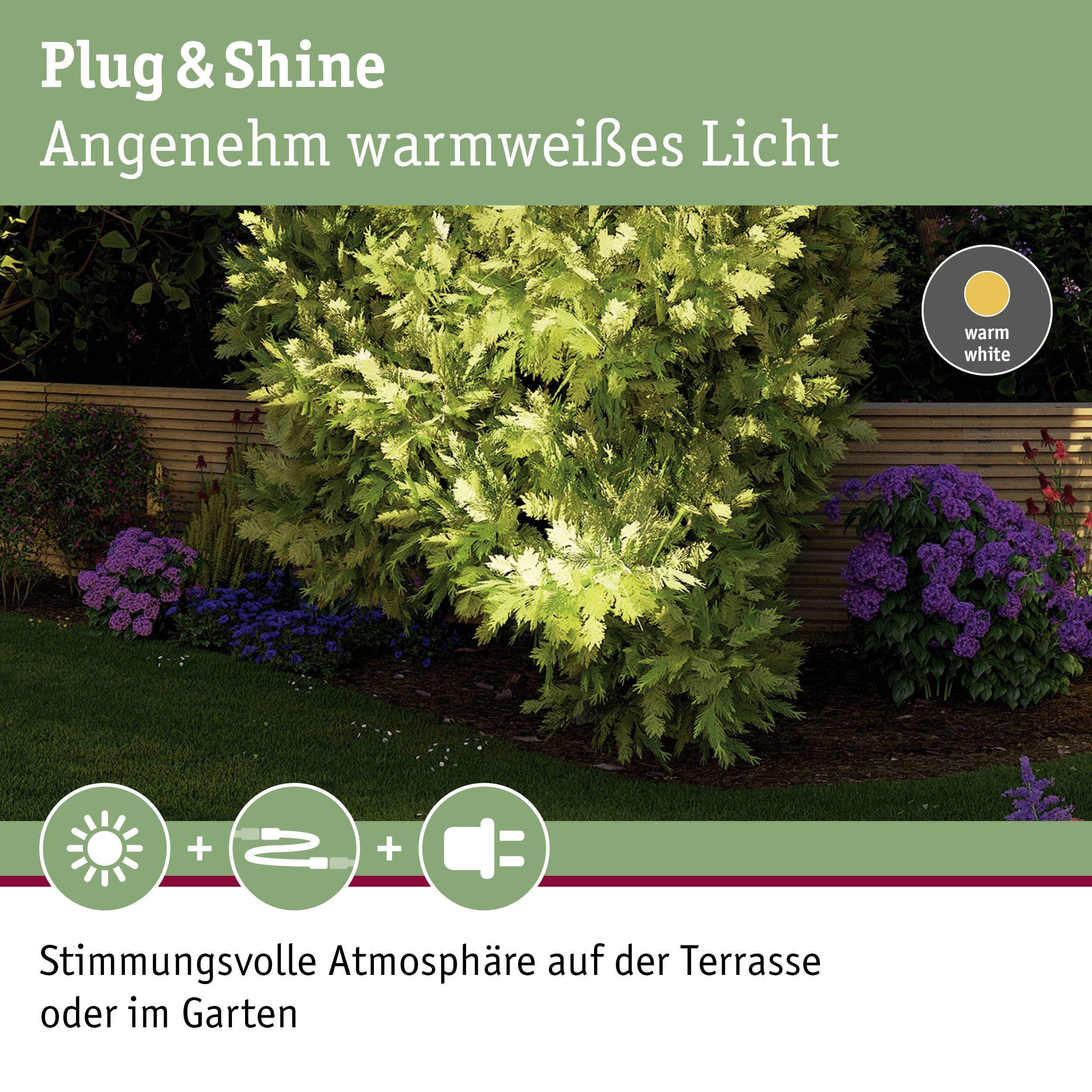 Plug & Shine vrtna rasvjeta s toplom bijelom bojom svjetla u vrtnom okruženju, idealna za atmosferično osvjetljenje terase ili vrta.