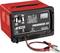 Crveni punjač baterija 'Progress 20' čvrste konstrukcije, s različitim postavkama napona i pokazivačem na prednjoj strani.