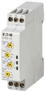 Sivi elektronički uređaj s tipkama i priključcima, označen natpisom 'EATON ETR2-44'. Koristi se za vremensko upravljanje ili prebacivanje.
