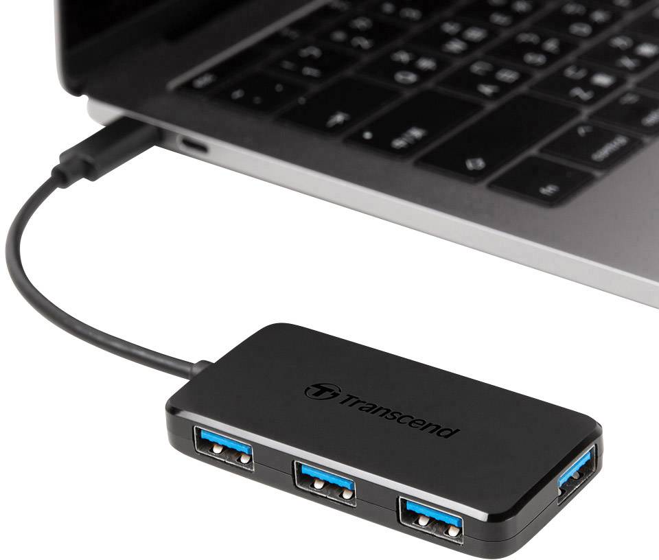 USB hub je spojen s prijenosnim računalom. Hub ima četiri USB porta i nosi logo 'Transcend'.