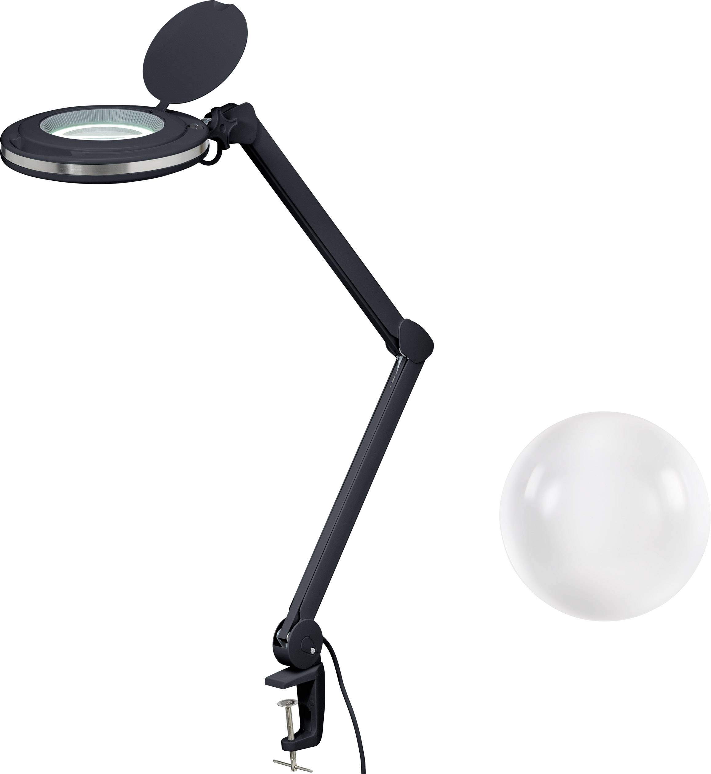 Crna stolna lampa s zglobnom rukom i okruglom povećalom, pored koje se nalazi jedna prozirna kugla na bijeloj pozadini.