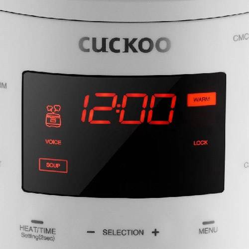 Električni rice cooker i multikoker s digitalnim zaslonom koji prikazuje '12:00' i različite funkcijske opcije.