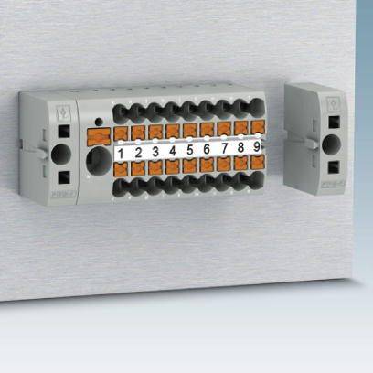 Razvodna ploča s numeriranim priključnim stezaljkama, poredanim u dva reda. Svaka stezaljka je numerirana od 1 do 12, za elektrotehničke spojeve.