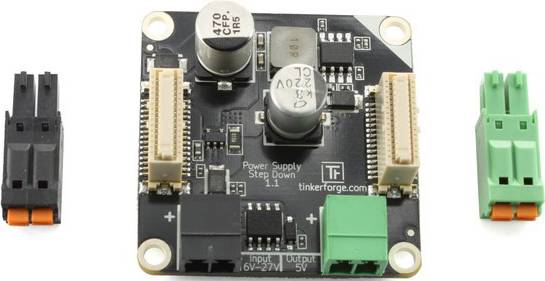 Elektronička komponenta s različitim utičnicama i natpisima 'Power Supply Step Down 11', 'tinkerforge.com'.