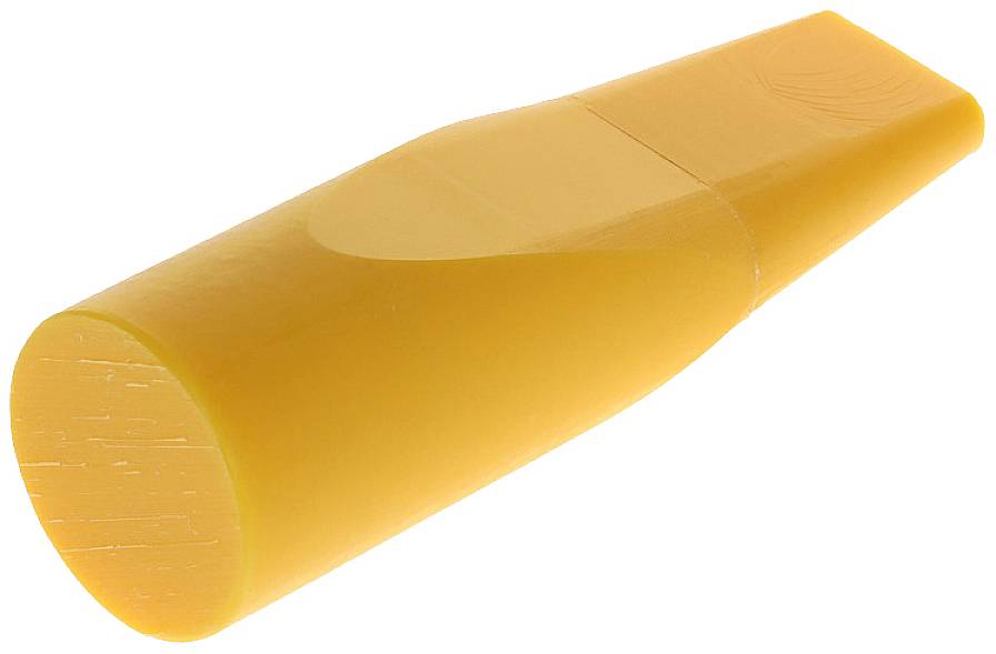 Žuti cilindrični štapić od voska u ležećem položaju.