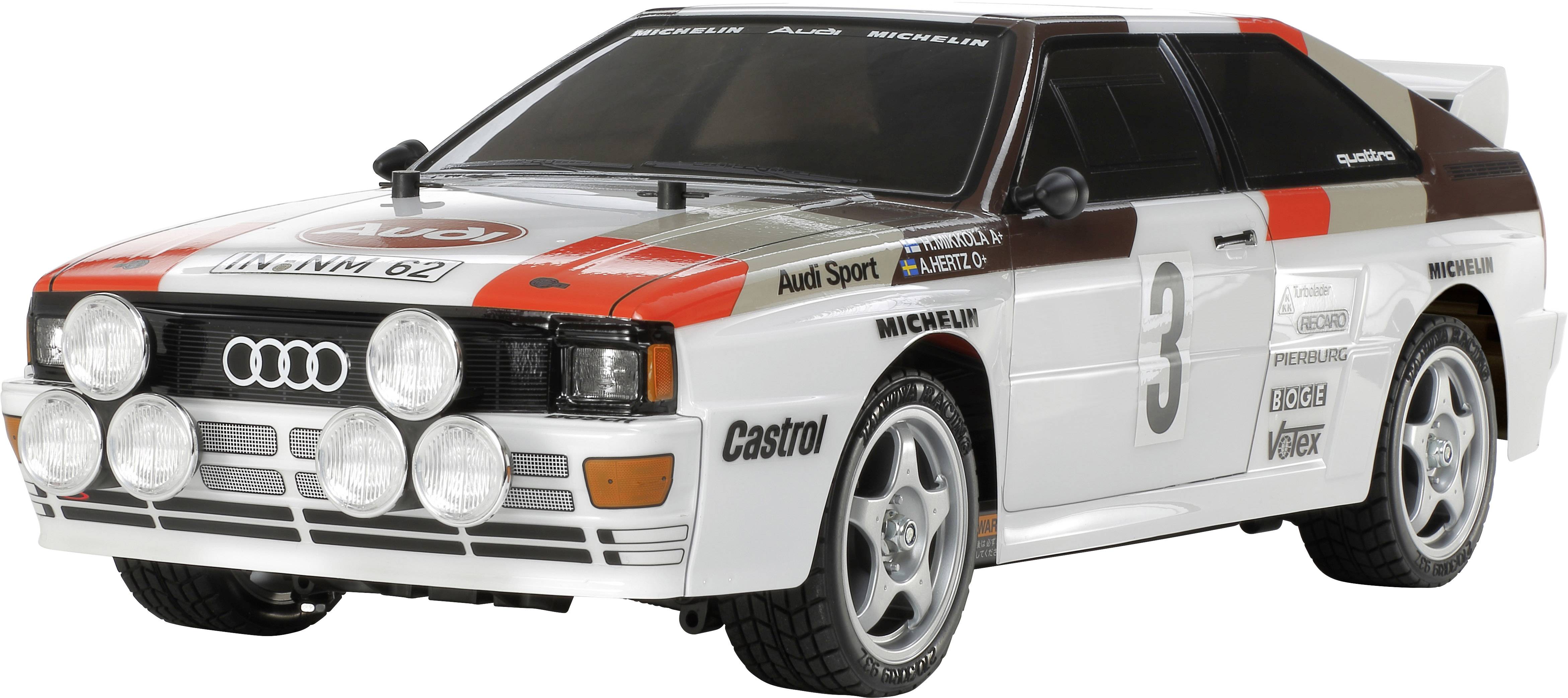 Model automobila relija u retro dizajnu, pretežno bijel s crnim i crvenim detaljima, startni broj 3 i nekoliko logotipa.