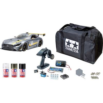 Daljinski upravljani set modela automobila sa srebrnim trkaćim automobilom, daljinskim upravljačem, bojama, punjačem, baterijama i prijenosnom torbom.