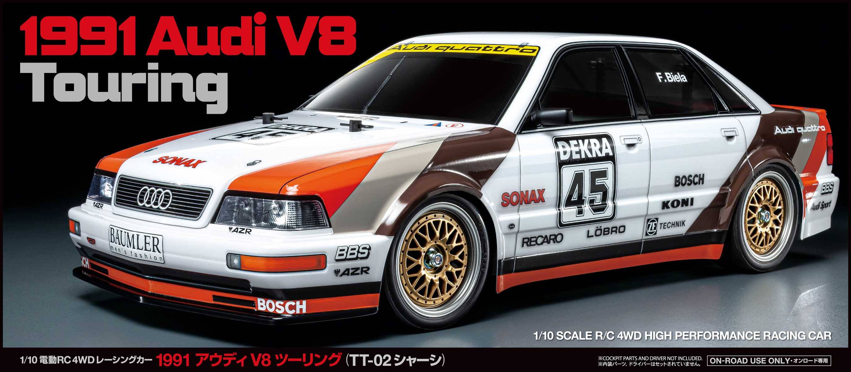 Bijeli Audi V8 touring automobil s crvenim i smeđim naglascima, označen natpisom '1991 Audi V8 Touring'. Natjecateljski broj 45.