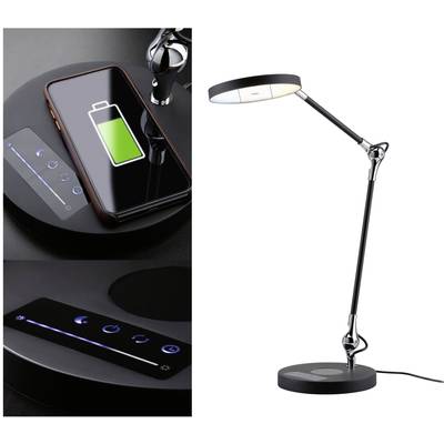 Crna stolna lampa podesivog kraka. Pored nje bežična punjač stanica s telefonom koji se prikazuje kako se puni, s prikazom simbola baterije.