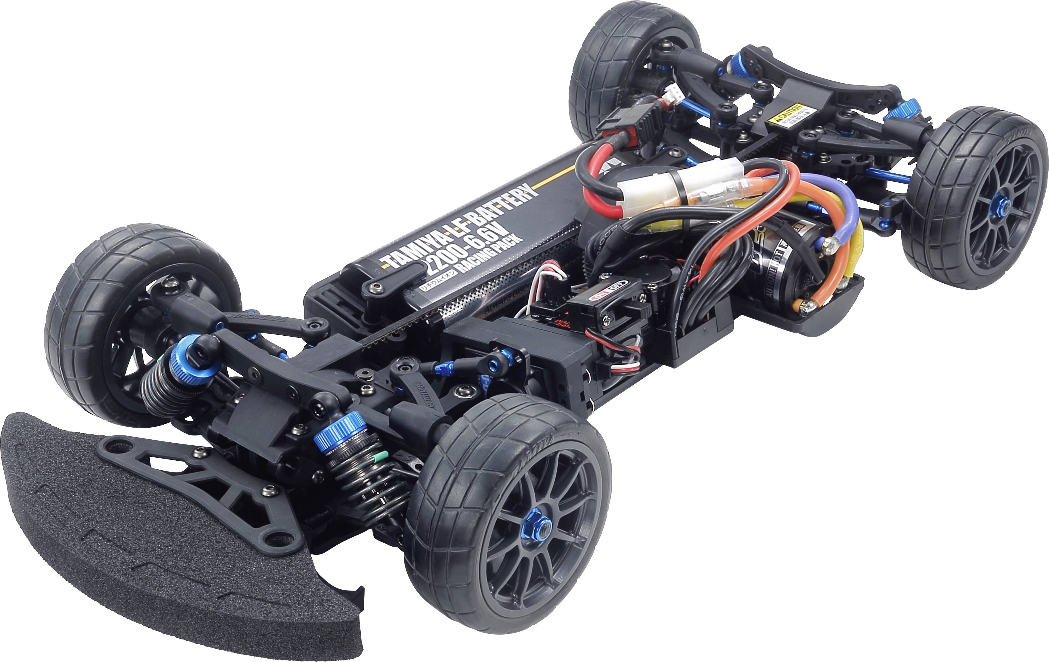 Model automobila bez karoserije koji prikazuje elektroniku, motor i ovjes. Četiri kotača montirana, s naglaskom na tehničke detalje.