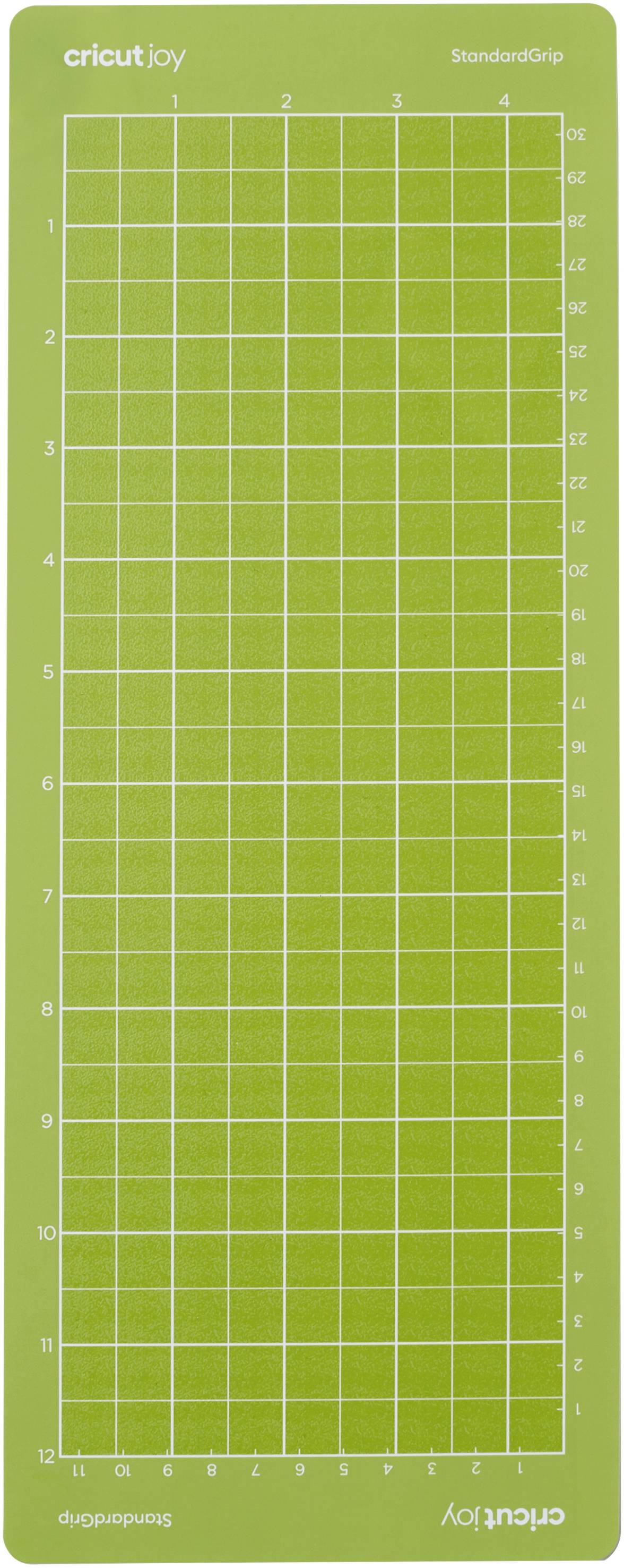 Zelena rezna podloga s rešetkastim uzorkom i numeriranim linijama. Logo 'Cricut Joy' gore desno.