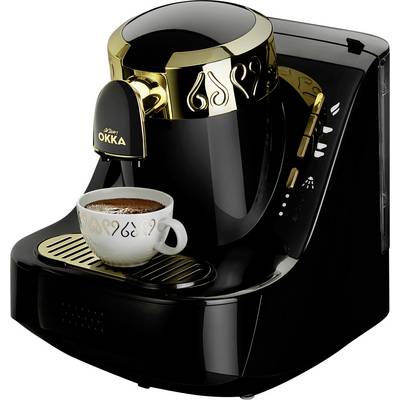 Crna kaffeemašina sa zlatnim ukrasima priprema šalicu kkave koja stoji na ceđaču ispod nje.
