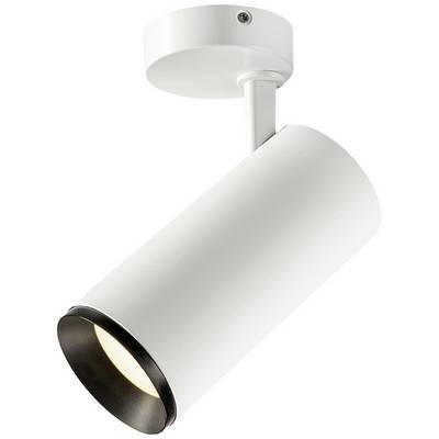 Bijela cilindrična stropna lampa s podesivim reflektorom, postavljena na okrugloj osnovici, emitira toplu svjetlost.