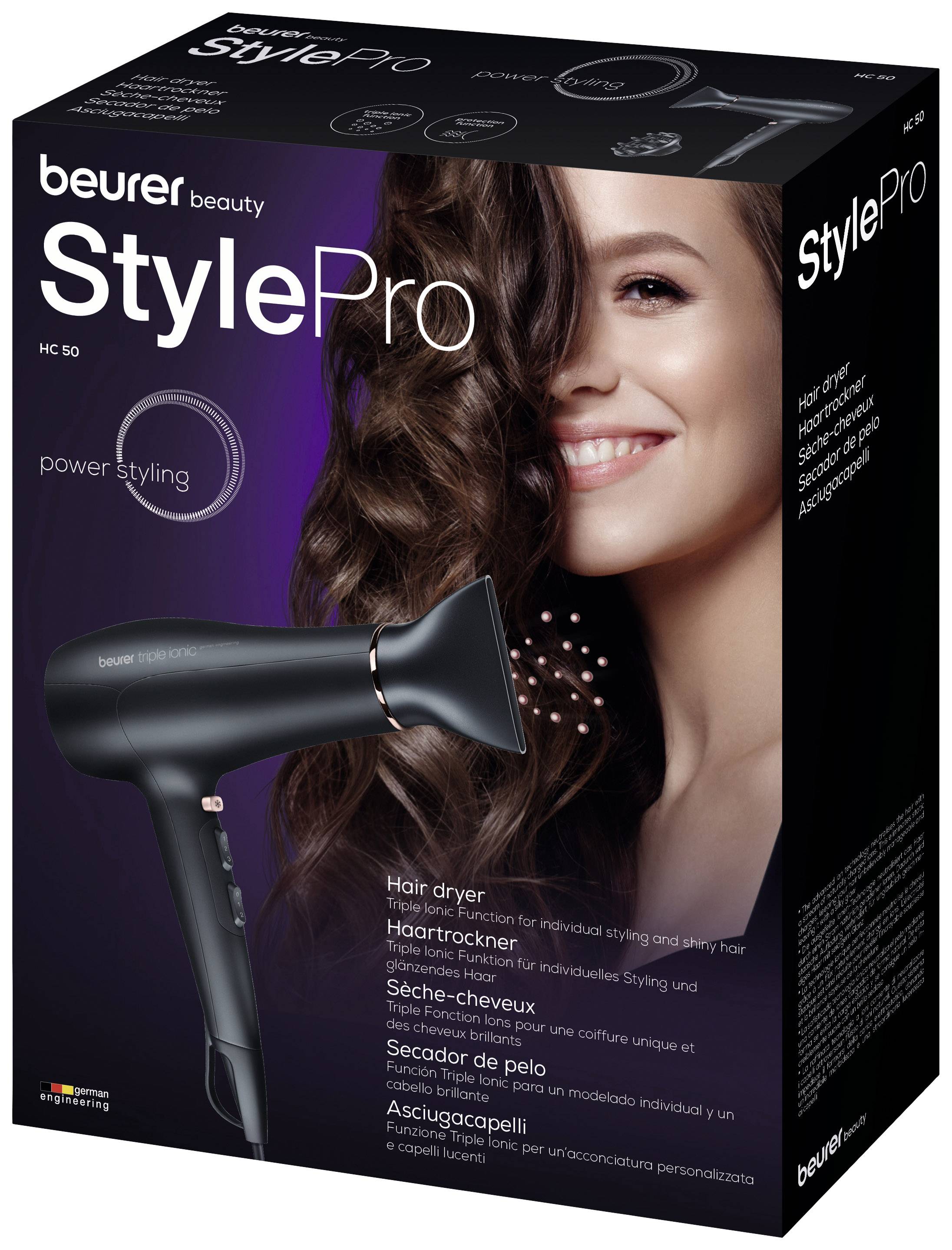Ambalaža crnog sušila za kosu 'Beurer StylePro'. Prikazuje osobu koja se smiješi s kovrčavom kosom, reklamira snažno stiliziranje.