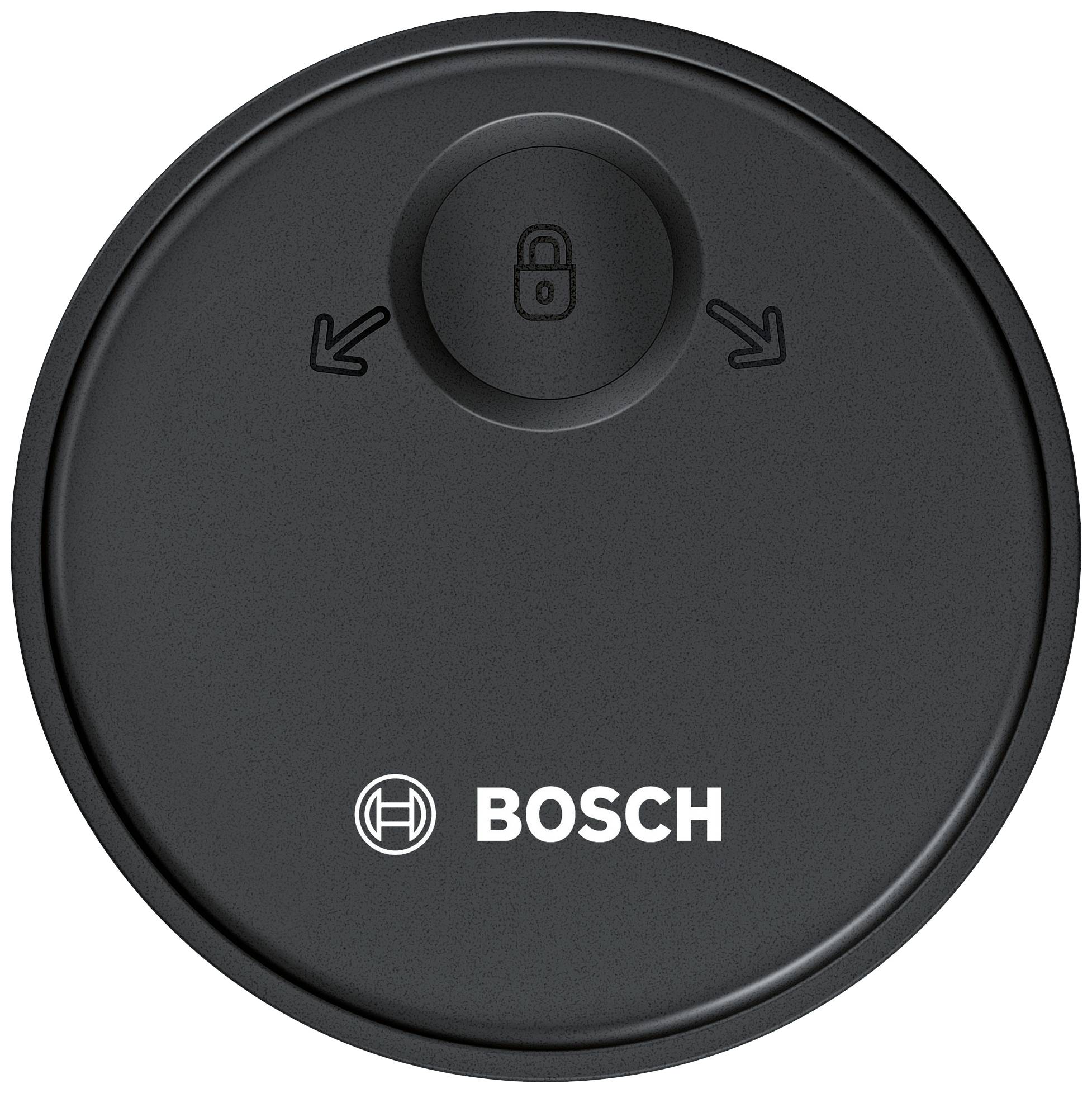 Crni okrugli gumb sa simbolom brave u sredini, okružen dvama strelicama. Ispod toga logo 'Bosch'-a.