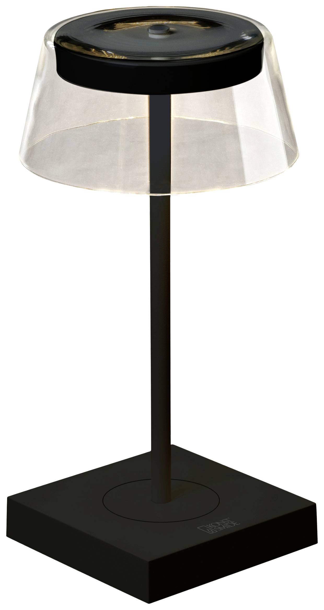 Moderna, crna stolna lampa s prozirnim sjenilom i kvadratnom bazom, postavljena na glatku površinu.