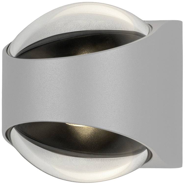 Siva cilindrična vanjska rasvjetna tijela s dvostrukim snopom svjetlosti usmjerenim gore i dolje. Idealna za montažu na zid.