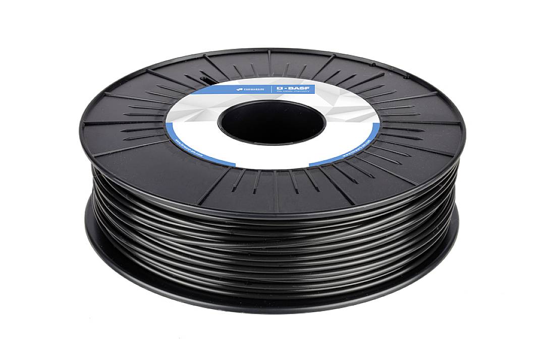 Crna plastična špula za 3D printer filament. Špula ima naljepnicu s informacijama o marki u sredini.