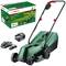 Zeleni akumulatorski kosilica trave Bosch s punjačem i akumulatorom, model 'EasyMower 18V-32-200'. Pakiranja u pozadini. Idealan za male vrtove.