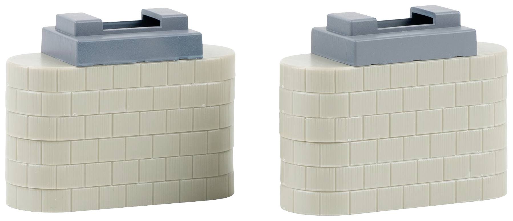 Dva bijela plastična bloka s postavljenim sivim poklopcima.