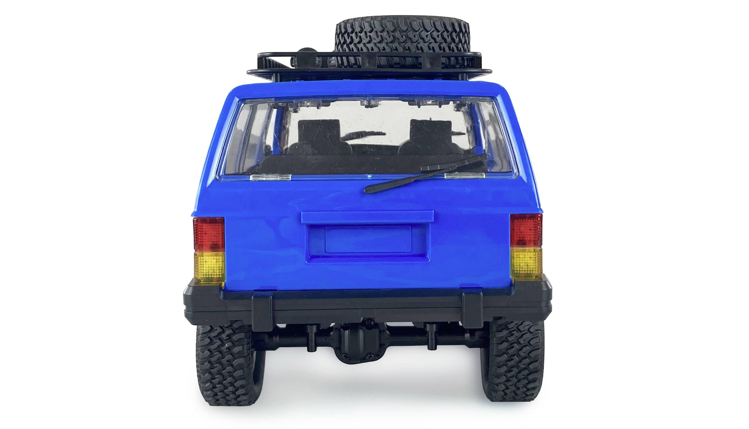 Plavo igračka automobil, pogled straga, sa rezervnim gumama na krovu.