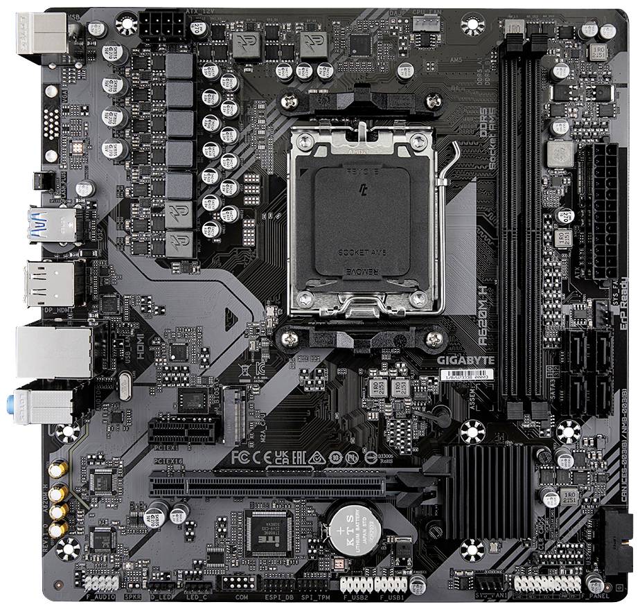 Crna matična ploča računala s različitim priključcima i čipovima, uključujući CPU utičnicu u sredini.