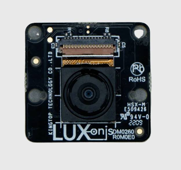 Mala kamera s natpisom 'LUX ONJ SDM0260 ROMEO'. Prikazuje elektroničku ploču, senzor u sredini, oznake za priključke.