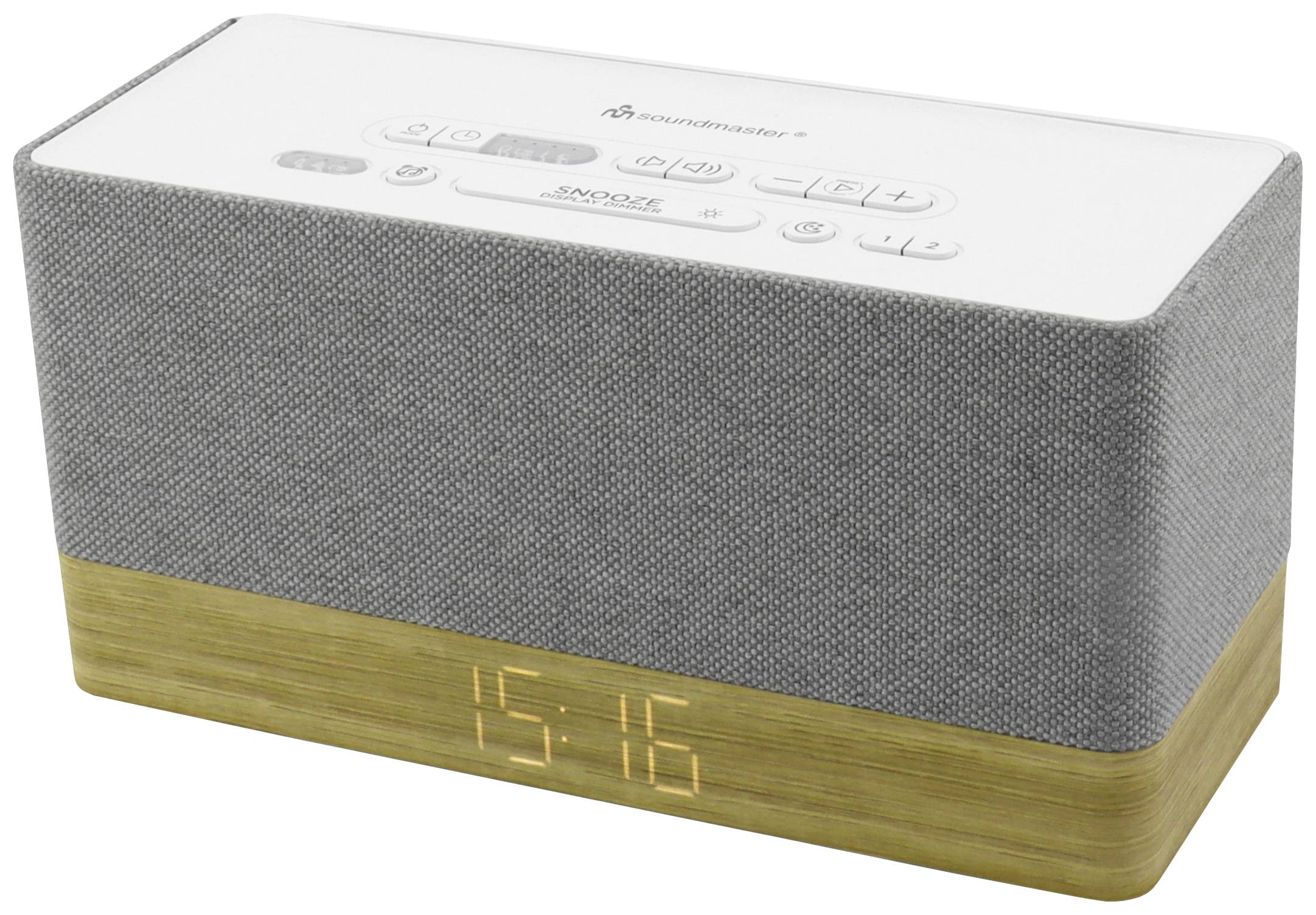 Sivi Bluetooth zvučnik s drvenim postoljem. Na vrhu su bijele upravljačke tipke i digitalni prikaz sata koji pokazuje vrijeme '15:16'.