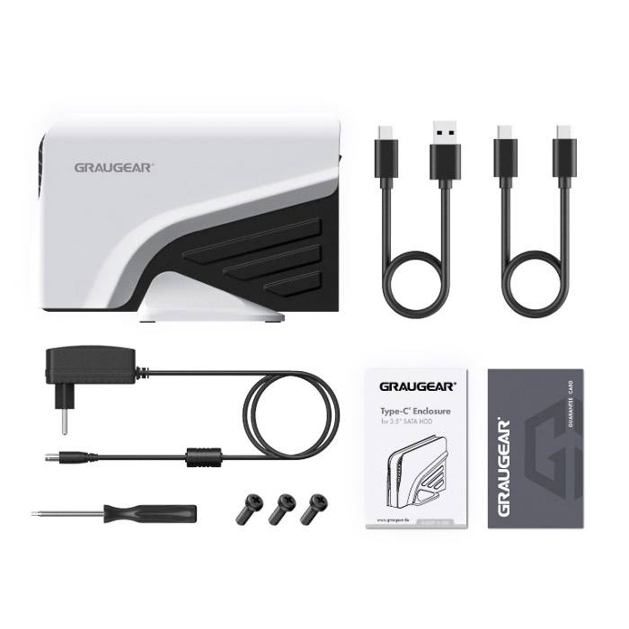 USB-C kućište set marke Graugear za montažu tvrdog diska, uključujući kablove, adapter, odvijač, vijke i upute.