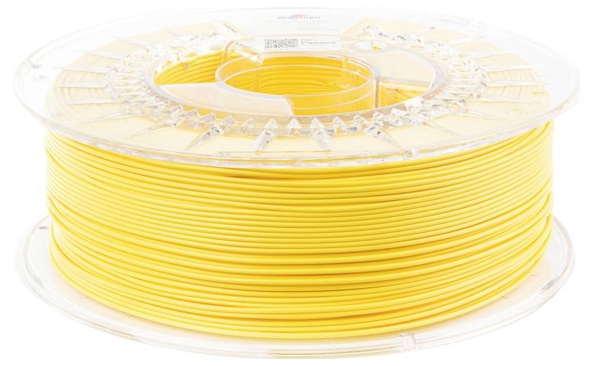 Žuta rolna filamenta za 3D printer, uredno namotana na prozirnoj plastičnoj jezgri zavojnice, spremna za upotrebu.