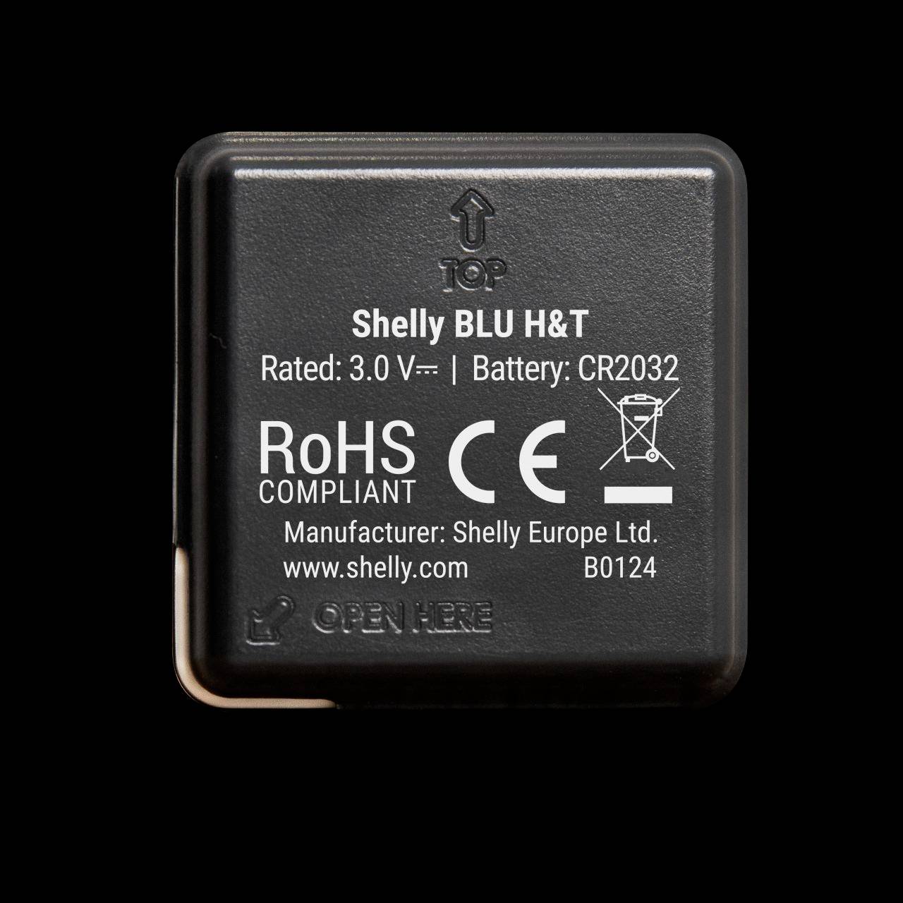 Crna poklopac baterije s natpisom 'Shelly BLU H&T'. Sadrži simbole i informacije o naponu, tipu baterije i proizvođaču.