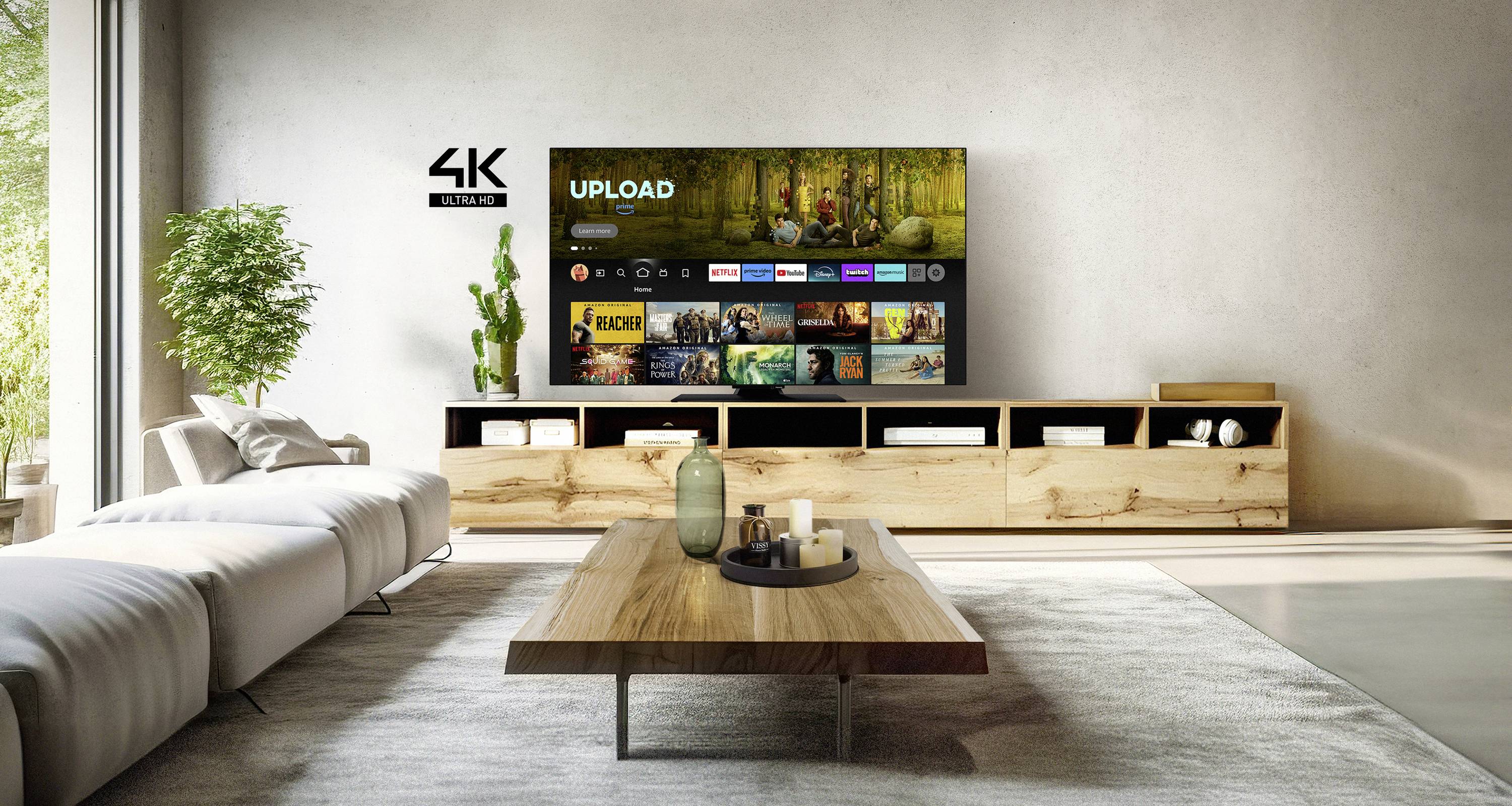 Moderan dnevni boravak s velikim ravnim televizorom na zidu. Na zaslonu se prikazuje aplikacija za streaming.