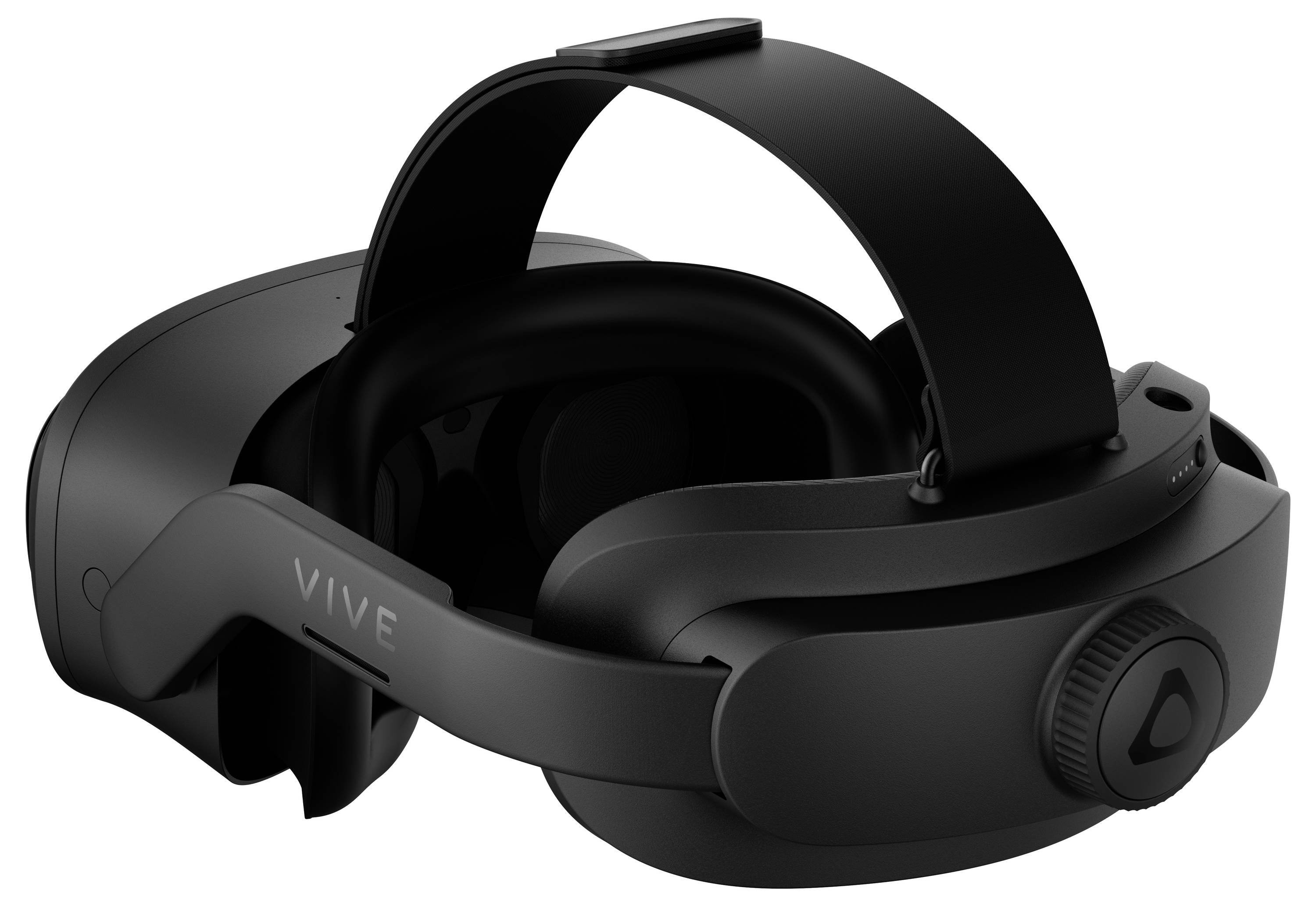 Crno Virtual Reality headset položeno postrance, s podesivom trakom za glavu i pjenaskom oblogom.
