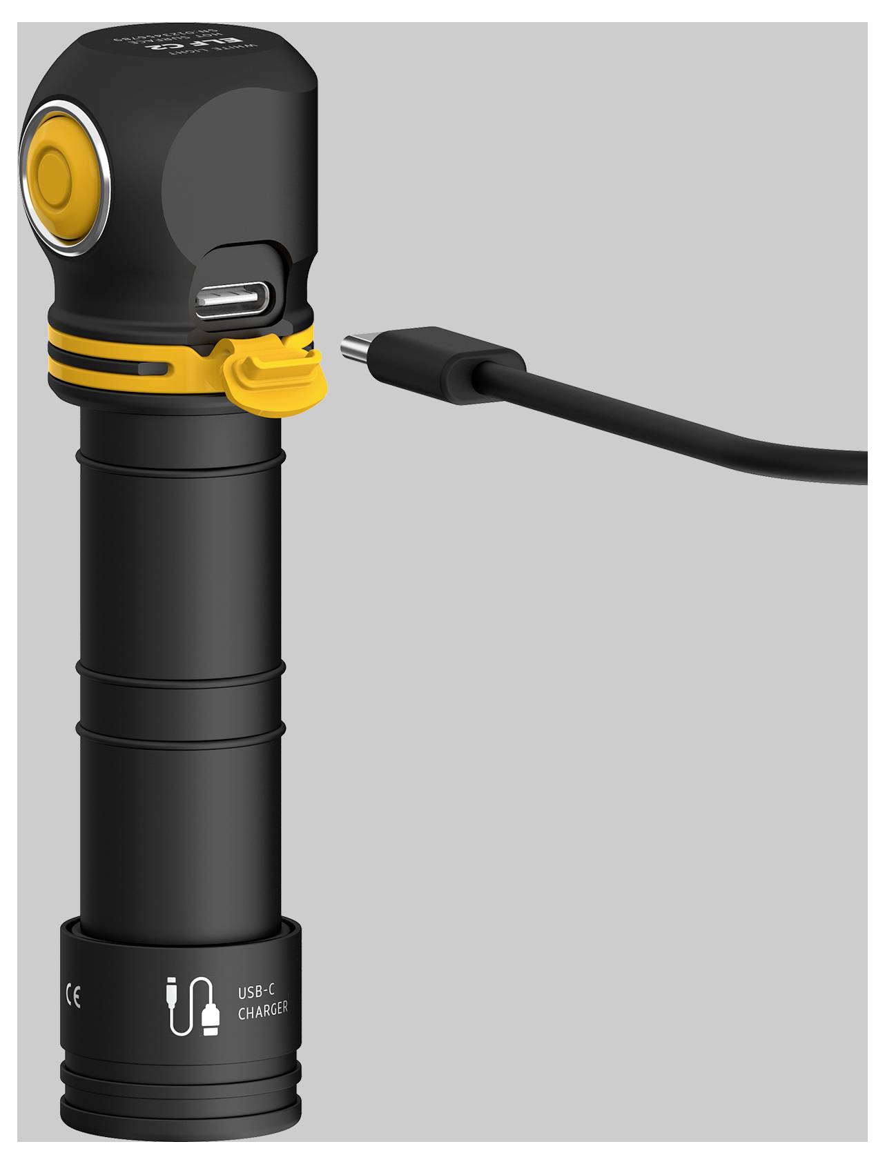 Ručna LED lampa u L-obliku s USB-C priključkom i punjačem. Kućište crne boje, žuti naglasci. Koristi se za osvjetljenje tijekom putovanja.