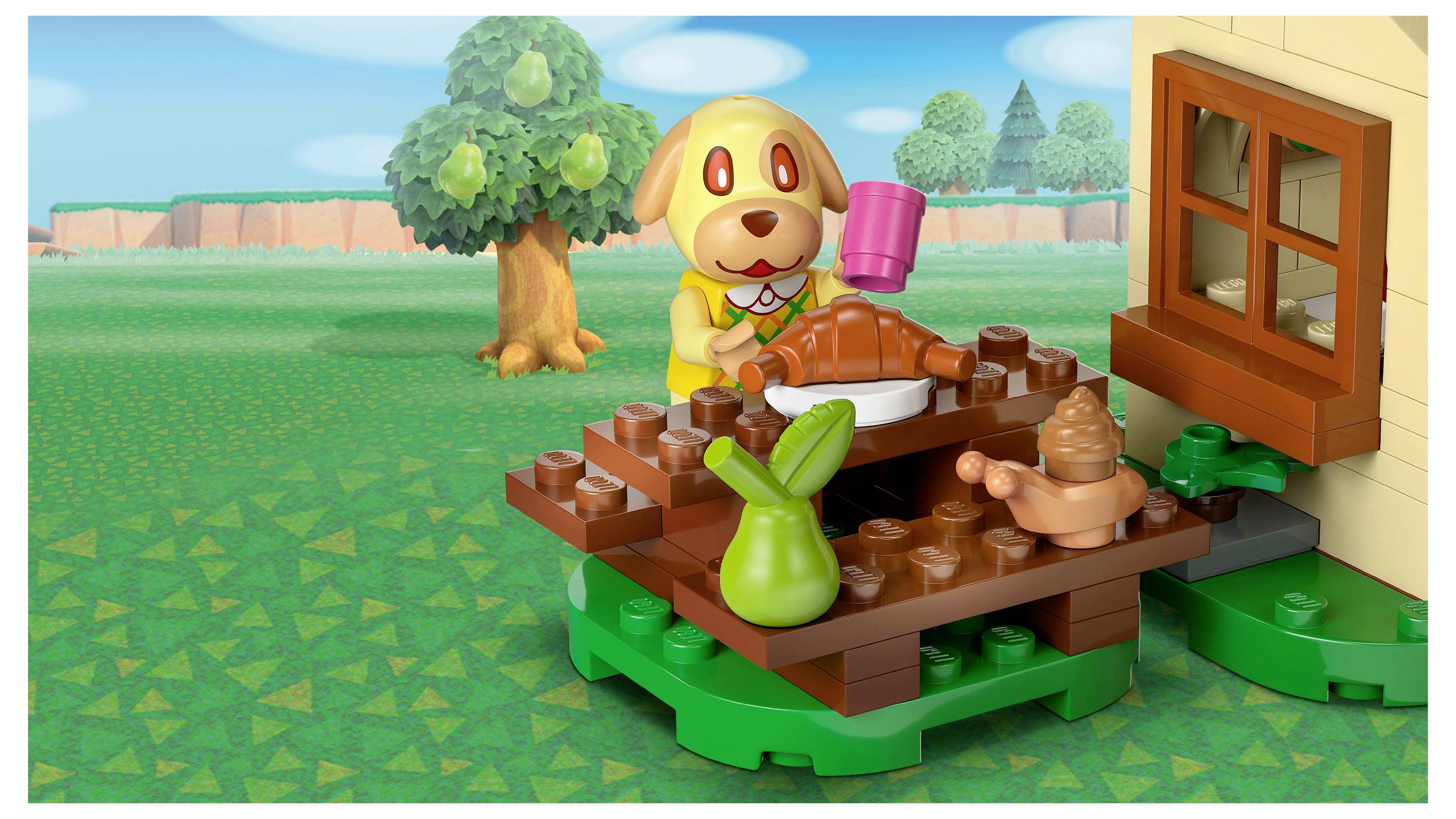 Figurica igračke sličnoj životinjskom liku izliva piće pokraj stola s hranom, smještena pored kuće i stabla u travnatom okolišu.