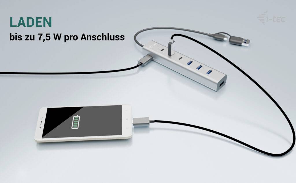 USB hub za punjenje pametnog telefona. Tekst: 'PUNJENJE do 7,5 W po priključku'. Uređaj ima više USB priključaka, mobitel se puni.