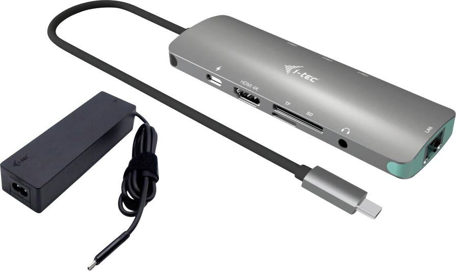 Višenamjenski adapter s različitim priključcima: HDMI, USB, Ethernet i drugo. Spojni kabeli i napajanje također su prikazani.