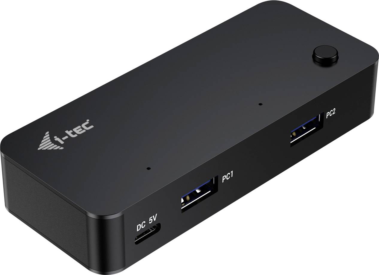 Crna USB docking stanica s dva USB porta, označena kao 'PC1' i 'PC2', te priključkom za napajanje 'DC 5V'.