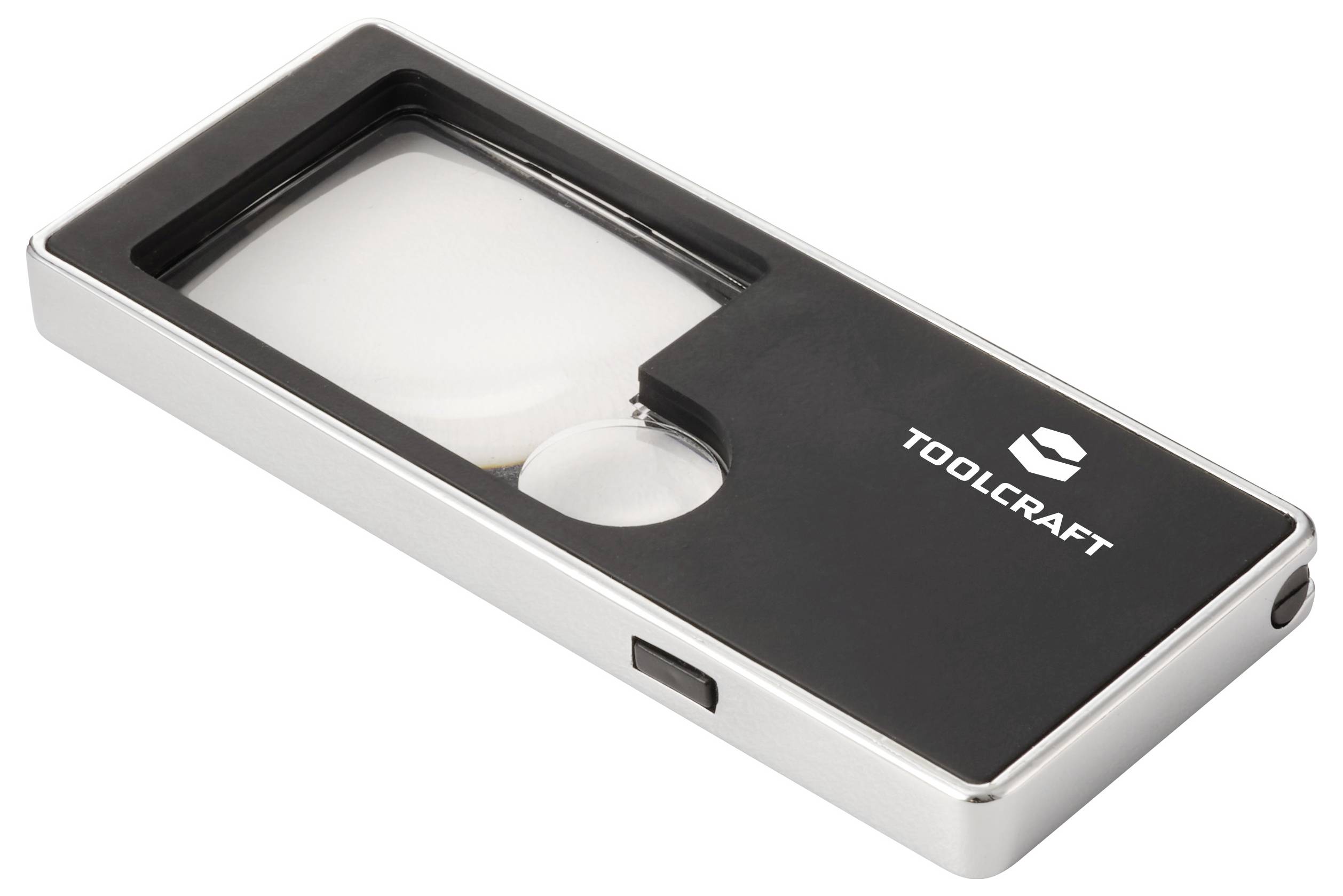 Crni pravokutni povećalo sa srebrnim rubom, okruglom lećom i natpisom 'TOOLCRAFT' bijелom bojom na prednjoj strani.