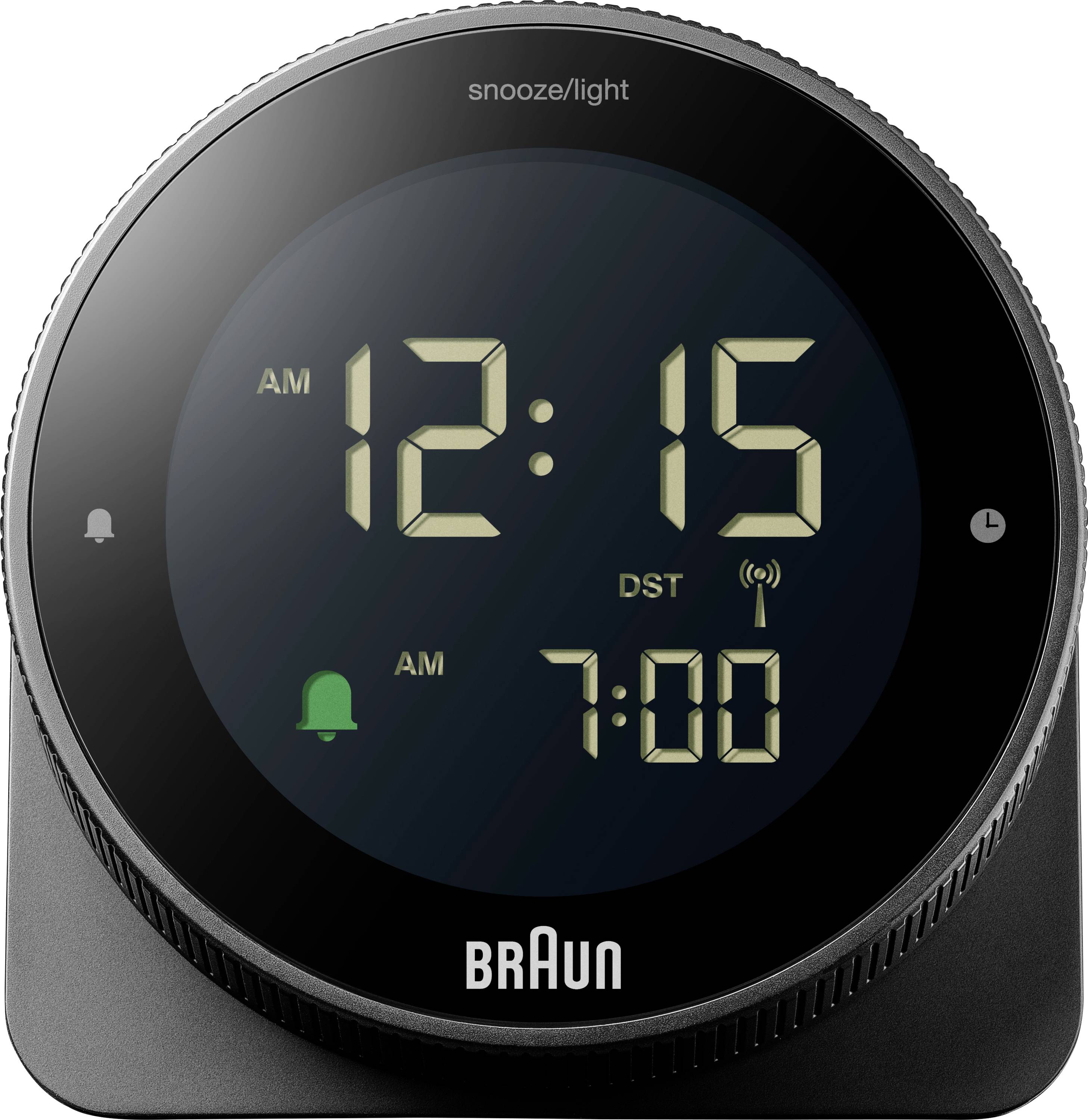 Okrugli Braunov digitalni sat za budenje prikazuje '12:15' ujutro, zelenu ikonu zvona za alarme, te postavljeno vrijeme alarma '7:00'.