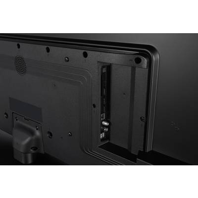 Stražnji panel televizora koji prikazuje različite priključke, uključujući HDMI i USB, u otvorenom odjeljku, koji ukazuje na mogućnosti povezivanja.