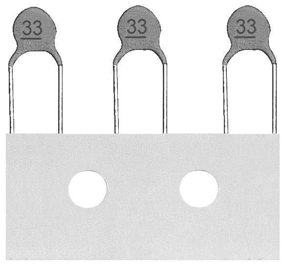 Tri siva termistora označena '33' poredana su vertikalno s metalnim priključcima, iznad ravne bijele pravokutne osnove s dva kružna otvora.