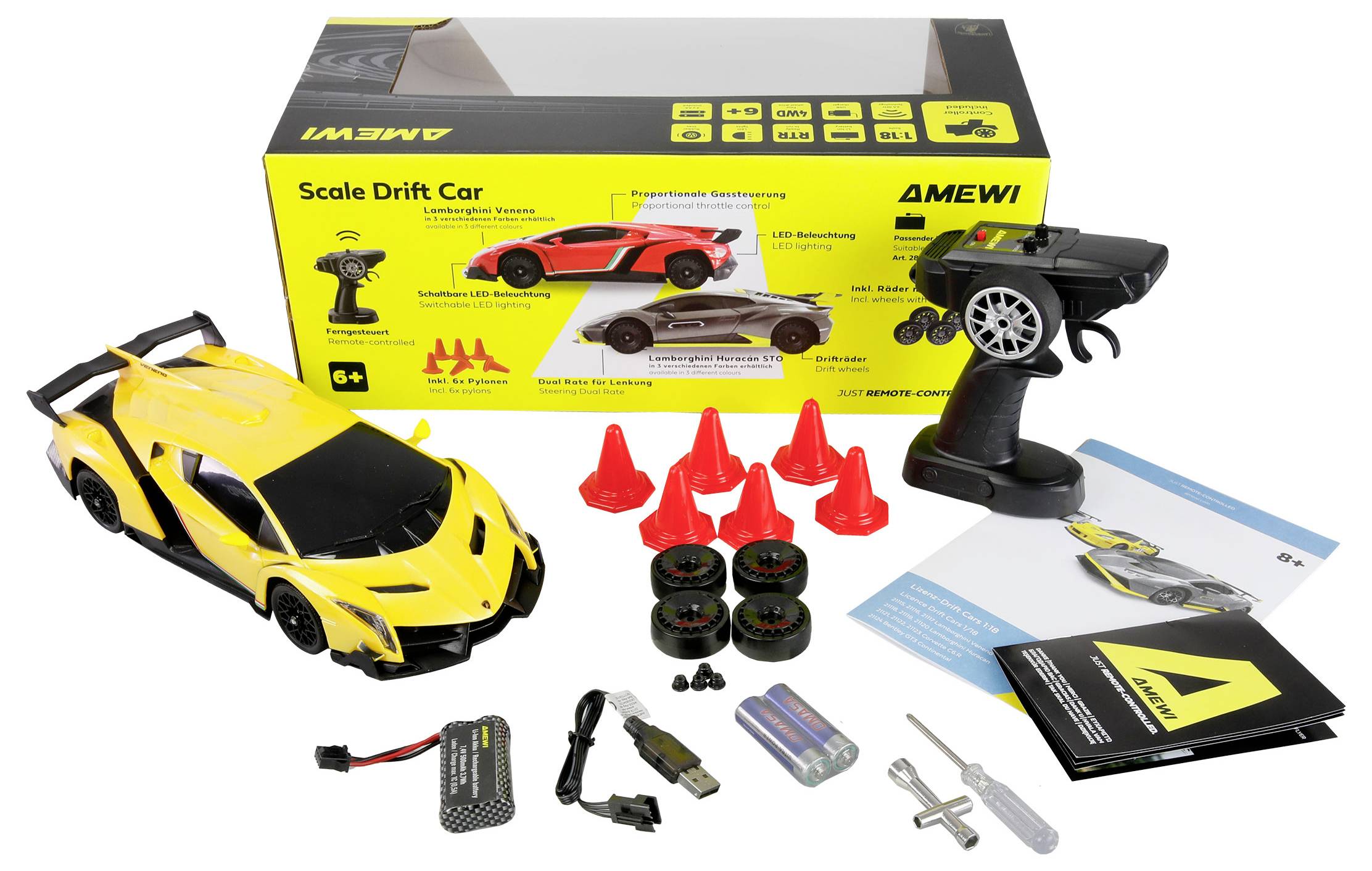Žuti model drift automobila s daljinskim upravljačem, čunjićima, kotačima, punjačem, baterijama i priručnikom, postavljen ispred kutije za pakiranje.