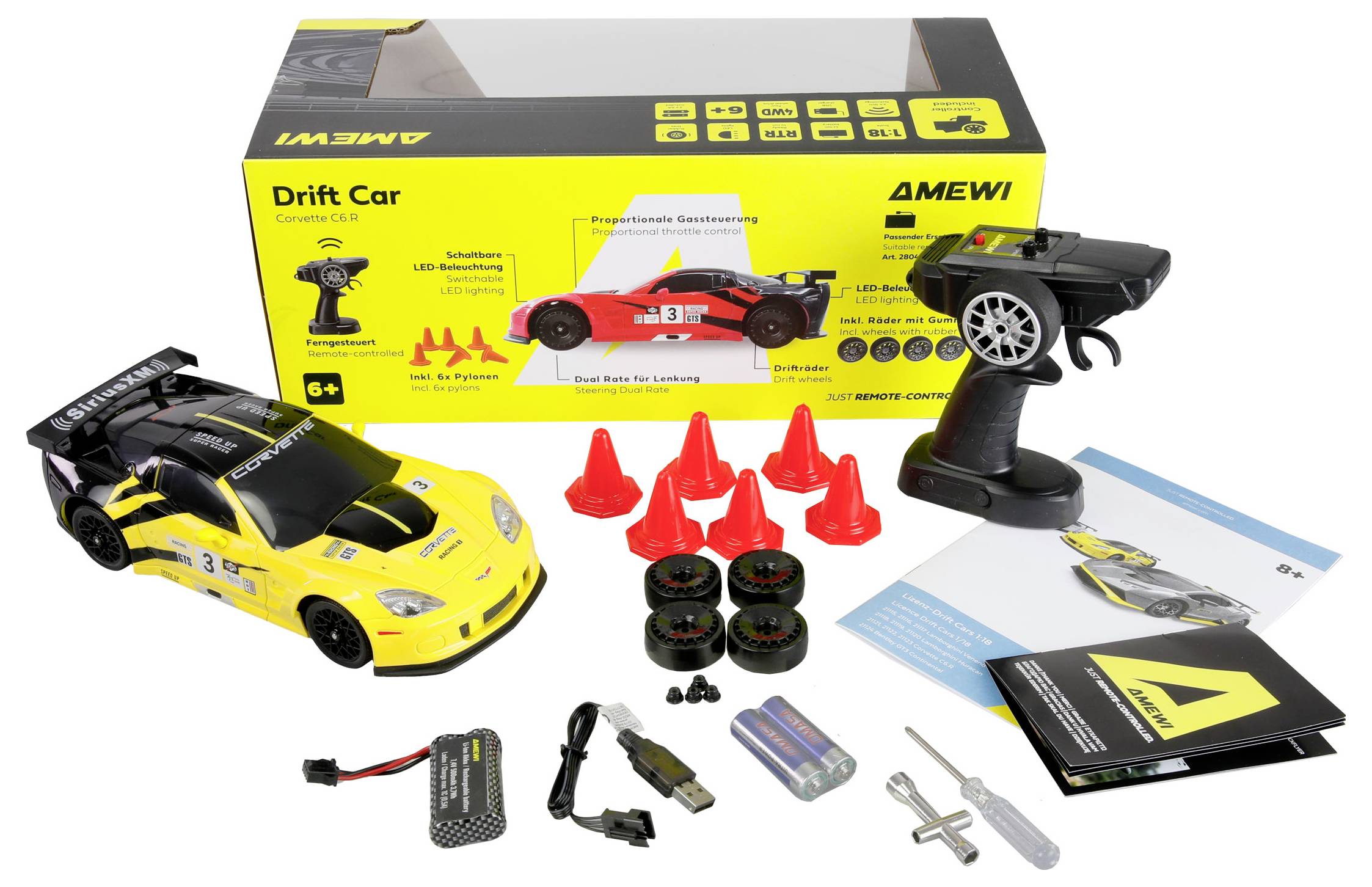 Daljinski upravljan žuti drift automobil set uključuje automobil, kontroler, četiri rezervne gume, osam čunjeva, baterije, punjač, odvijač i priručnik.